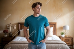 Man wearing teal t shirt in bedroom image Product Image 1