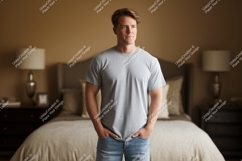 Man wearing grey t shirt and blue jeans Product Image 1