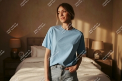Woman wearing light blue t shirt and denim shorts image Product Image 1