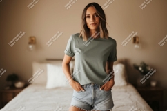 Woman wearing green t shirt and denim shorts t-shirt Product Image 1