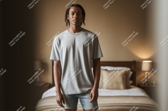 Man wearing grey t shirt and denim shorts Product Image 1
