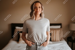 Woman wearing grey t shirt and denim jeans image Product Image 1