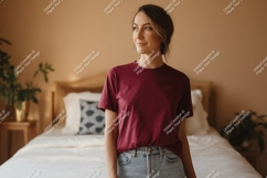 Woman wearing maroon t shirt and jeans image Product Image 1