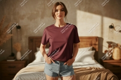 Woman wearing maroon t shirt and denim shorts image Product Image 1