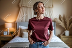 Woman wearing maroon t shirt and jeans image Product Image 1