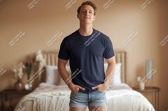 Man wearing navy t-shirt and denim shorts Product Image 1