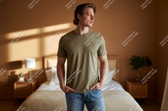 Man wearing olive green t shirt and denim jeans image Product Image 1