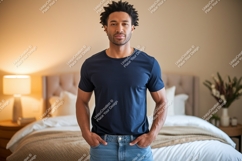 Man wearing dark blue t shirt and jeans image Product Image 1