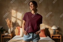 Woman wearing maroon t shirt and denim shorts image Product Image 1