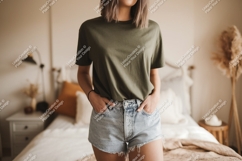 Woman wearing olive green t shirt and denim shorts Product Image 1