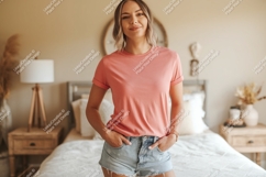 Woman wearing coral t shirt and denim shorts image Product Image 1