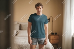 Man wearing teal t shirt and denim shorts image Product Image 1