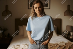 Woman wearing light blue t shirt and denim jeans image Product Image 1