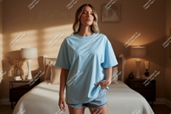 Woman wearing light blue t shirt and denim shorts t-shirt Product Image 1