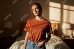 Woman wearing orange t shirt and jeans image Product Image 1