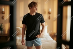 Man black t shirt denim shorts indoor mockup image Product Image 1