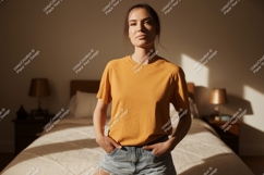 Woman wearing orange t shirt and denim shorts Product Image 1