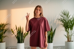 Woman wearing maroon t shirt peace sign image Product Image 1