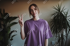 Woman peace sign purple shirt image Product Image 1