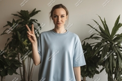 Woman peace gesture light blue shirt image Product Image 1