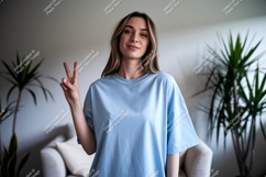 Woman peace sign blue shirt image Product Image 1