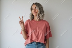 Woman wearing pink t shirt and jeans image Product Image 1
