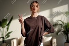 Woman wearing brown t shirt peace Product Image 1