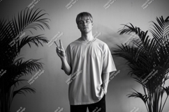 Young man peace sign plant Mockup image Product Image 1