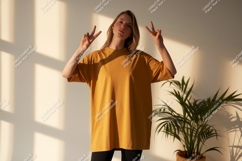 Woman wearing mustard t shirt peace gesture image Product Image 1
