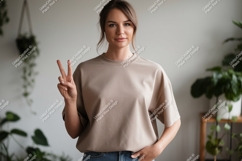 Woman wearing beige t shirt peace sign image Product Image 1