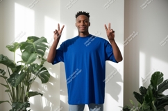 Man wearing blue t shirt with peace signs image Product Image 1