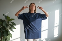 Woman wearing dark blue t shirt peace sign image Product Image 1