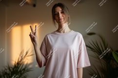 Young woman peace sign pink shirt image Product Image 1