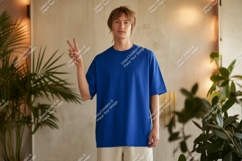 Young man blue shirt peace sign image Product Image 1