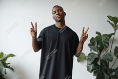 Man black shirt peace gesture image Product Image 1
