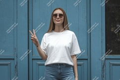 Woman white t shirt blue jeans sunglasses peace sign Product Image 1