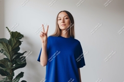 Woman wearing blue t shirt peace sign image Product Image 1