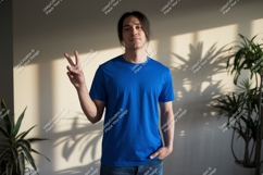 Man blue shirt peace sign image Product Image 1