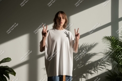 Woman wearing white t shirt peace sign t-shirt Product Image 1