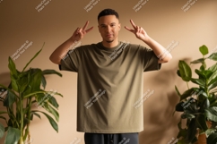 Man wearing olive green t shirt peace sign image Product Image 1