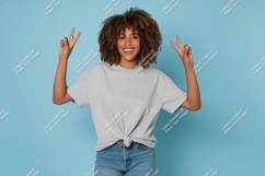 Woman grey t shirt denim jeans peace sign image Product Image 1