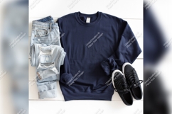Navy Blue Sweatshirt Mockup With Distressed Jeans Product Image 1