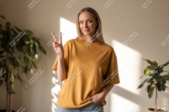 Woman wearing mustard t shirt casual Product Image 1