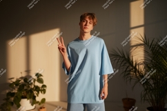 Young man peace sign light blue shirt image Product Image 1