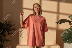 Woman wearing coral t shirt peace sign image Product Image 1