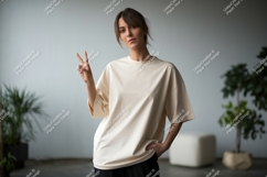 Woman wearing cream t shirt peace sign image Product Image 1