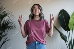 Woman wearing pink t shirt and jeans image Product Image 1