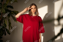 Woman wearing red mockup t shirt image Product Image 1