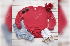 Red Sweatshirt Tshirt Mockup Laid Flat On Wood Background Product Image 1