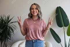 Woman peace sign gesture pink shirt Product Image 1